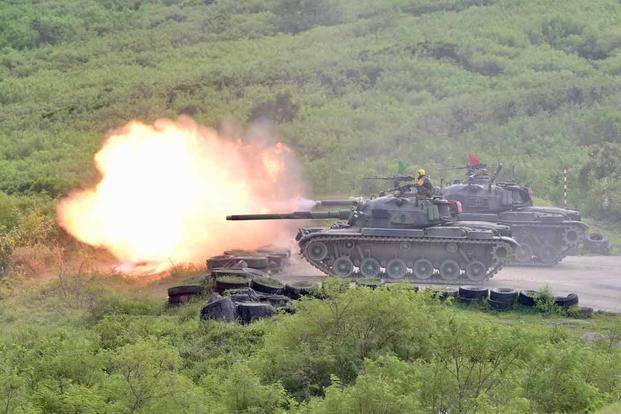 CM-11 tanks during a live-fire military exercise in southern Taiwan.
