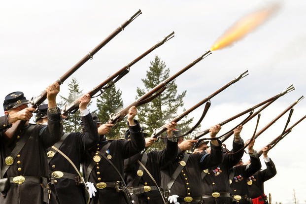 An honors salute is fired during a funeral for a Civil War veteran at the Willamette National Cemetery in Portland, Ore.