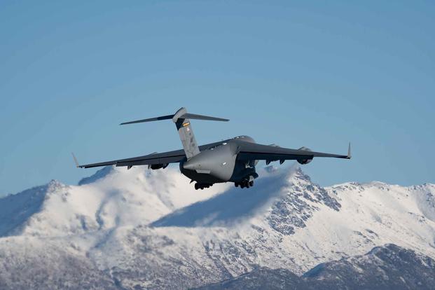 An Air National Guard C-17 takes off in Alaska.