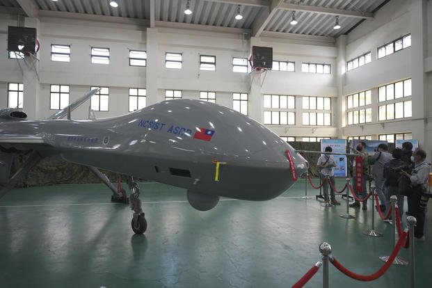 Members of the media look at the Taiwanese developed large UAV Teng Yun