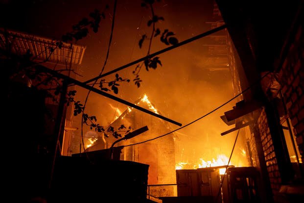 A house burns after a Russian attack in Kherson, Ukraine.