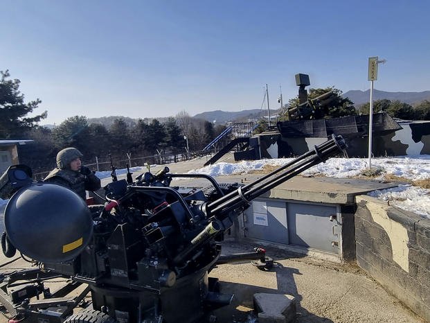 South Korean soldiers operate a vulcan automatic cannon during a military exercise in Yangju