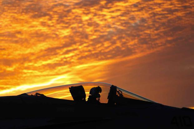 An F/A-18E Super Hornet taxies on the USS Abraham Lincoln.