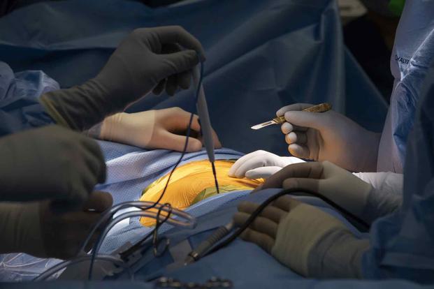 Doctor prepares to make the initial incision at the start of a surgery, Feb. 26, 2019. (U.S. Ari Force photo by Heide Couch)