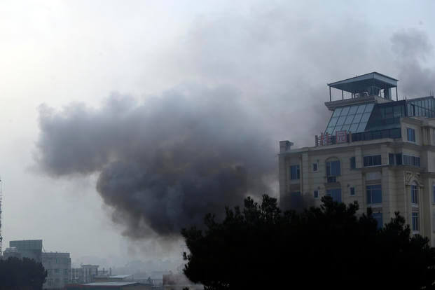 Smoke rises from a hotel building after an explosion and gunfire in the city of Kabul, Afghanistan
