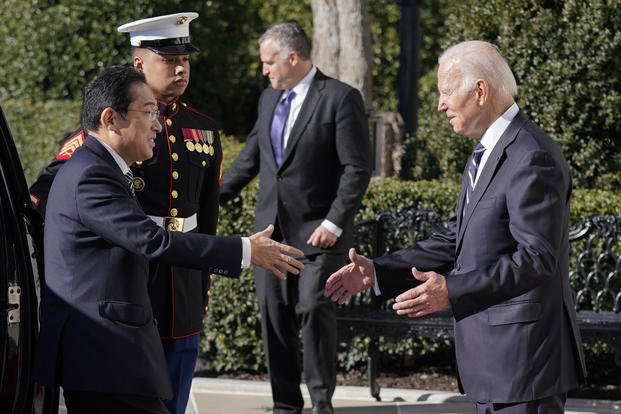 President Joe Biden greets Japanese Prime Minister Fumio Kishida.