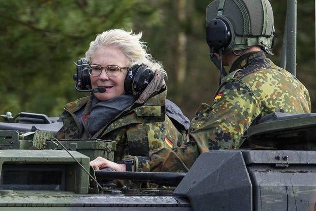 Christine Lambrecht, Minister of Defense, rides in a tank in Munster, Germany.