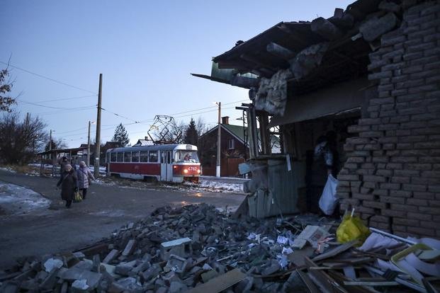 damaged house after what Russian officials in Donetsk said it was a shelling by Ukrainian forces