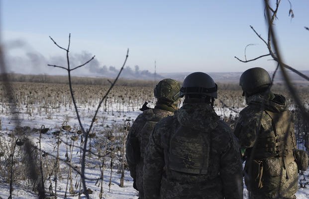 Ukrainian soldiers watch during fighting between Ukrainian and Russian forces in Soledar, Donetsk region, Ukraine