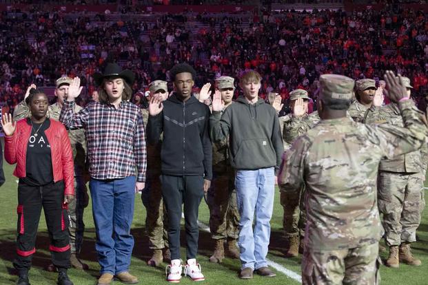oath of enlistment during s during football game.