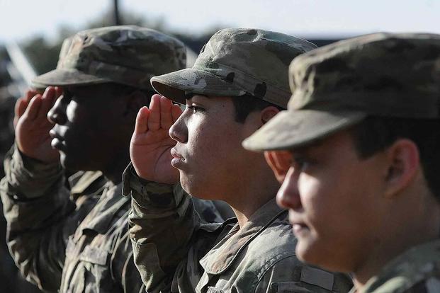 Soldiers salute during Drill and Ceremony Competition.