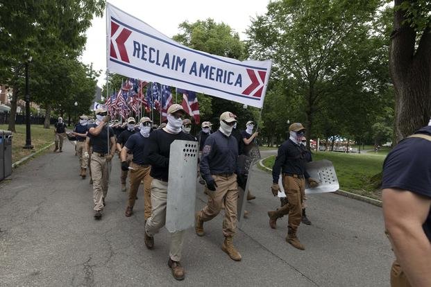 Marchers bearing the insignia of the white supremacist group Patriot Front.
