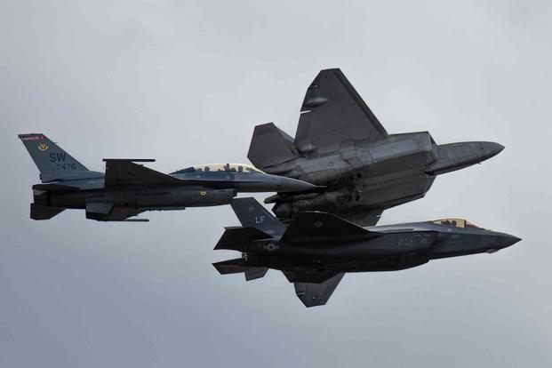 U.S. Air Force F-16 Viper, F-35 Lighting II and F-22 Raptor fly in formation.