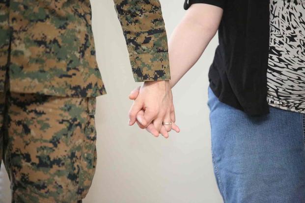 Couple holds hands at Marine Corps Base Quantico.
