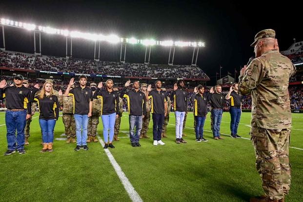 Oath of Enlistment at Salute to Military Service football game.