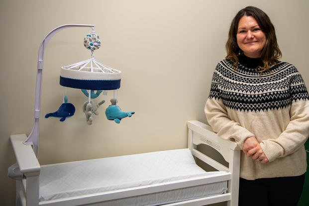 Shannon Williams, part of the Navy and Marine Corps Relief Society’ Visiting Nurse Program, poses in the NMCRS Rota lactation room in Spain.