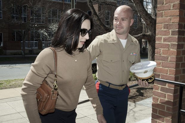 Marine Maj. Joshua Mast and his wife, Stephanie, arrive at Circuit Court.