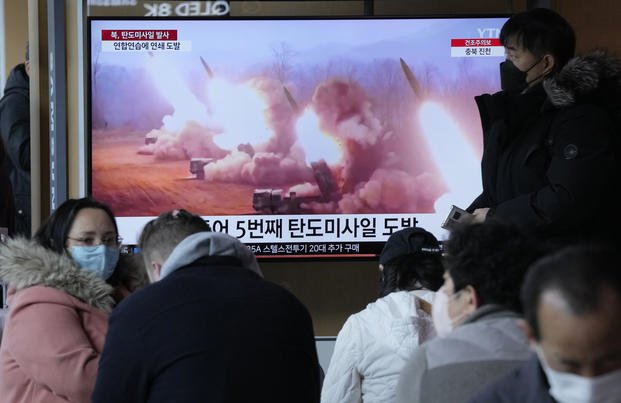 TV screen shows a file image of North Korea's missile launch during a news program