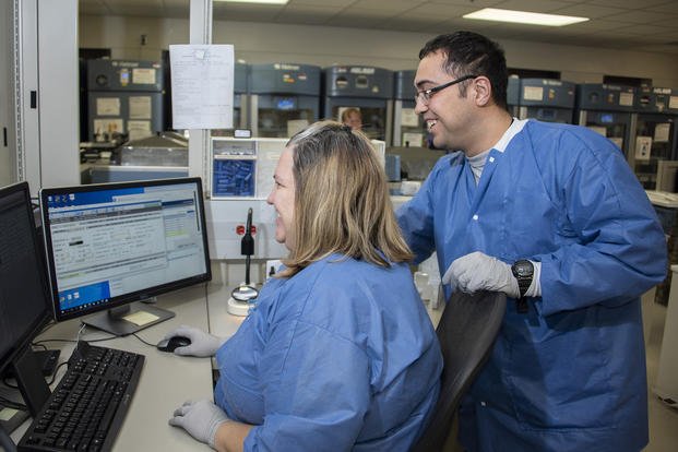 Medical laboratory technicians assign plasma to a patient before surgery at Brooke Army Medical Center, Fort Sam Houston, Texas.