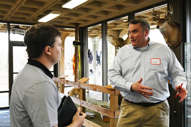Structural Section Chief Jonathan Bartusiak explains to a potential hire candidate the benefits of working for the Corps of Engineers during the Nashville District job fair at J. Percy Priest Lake in Nashville, Tennessee.