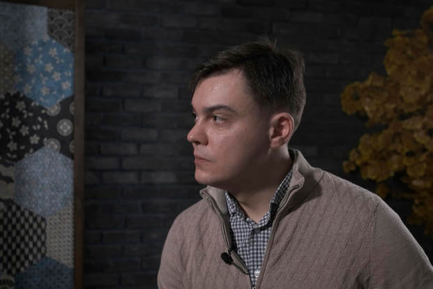 Russian Defector Gleb Karakulov speaks during an interview.