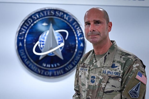 Chief Master Sgt. John F. Bentivegna stands in front of the U.S. Space Force Hallway after receiving news on his selection as the next chief master sergeant of the Space Force at the Pentagon in Arlington, Va.