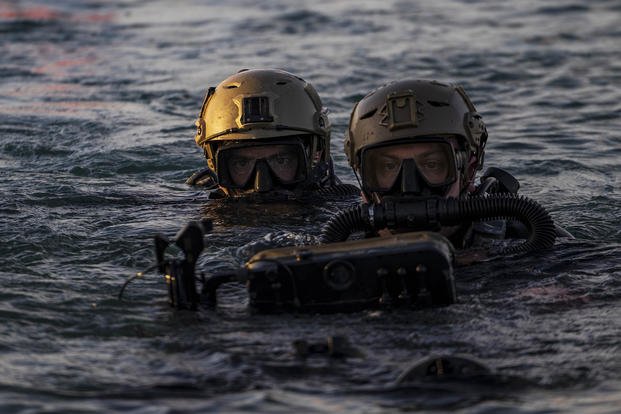 Navy divers assigned to Naval Special Warfare (NSW) Group Two conduct training with an underwater propulsion vehicle off the coast of Key West, Florida.