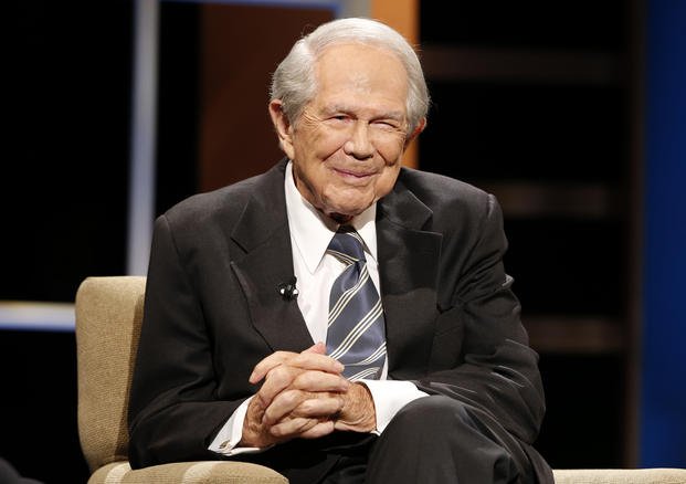 Rev. Pat Robertson poses a question to a Republican presidential candidate.