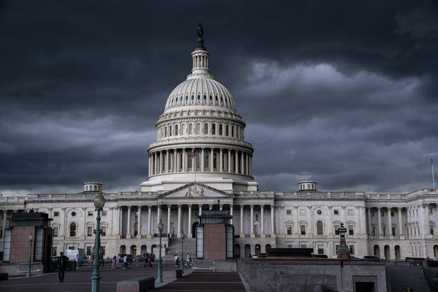 Storm clouds darken the skies above the Capitol in Washington