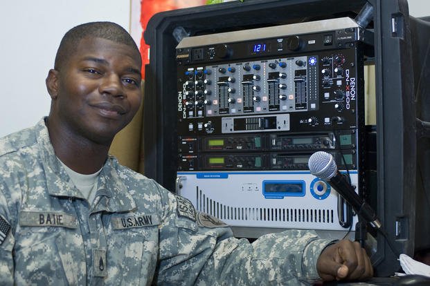 U.S. Army Staff Sgt. Evan L. Batie, a reservist with the 319th Psychological Operations Company, 13th Psychological Operations Battalion, poses in front of the ‘radio in a box’ at Forward Operating Base Lightning, Paktya province, Afghanistan.