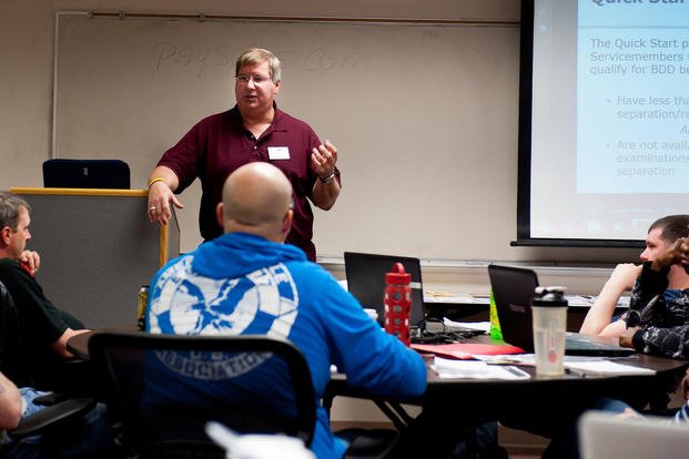 A Pennington County Veterans Service Office staff member discusses VA benefits available to airmen during a Transition Assistance Program class on Ellsworth Air Force Base, S.D.