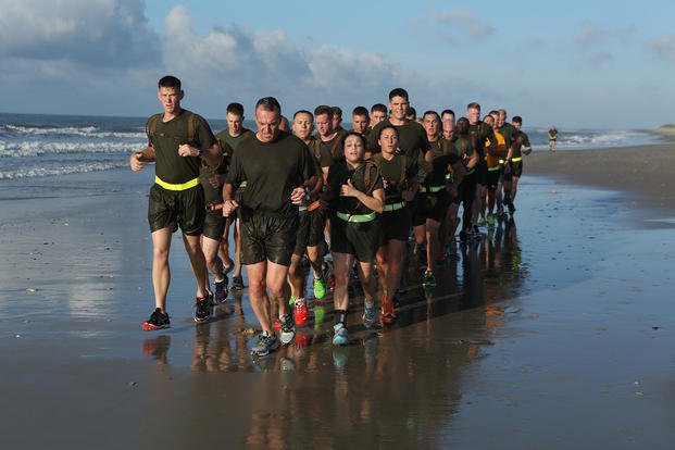 U.S. Marine Corps Brig. Gen. Charles Chiarotti, commanding general, 2nd Marine Logistics Group (2nd MLG), takes the command element of 2nd MLG for a run on Onslow Beach, N.C.