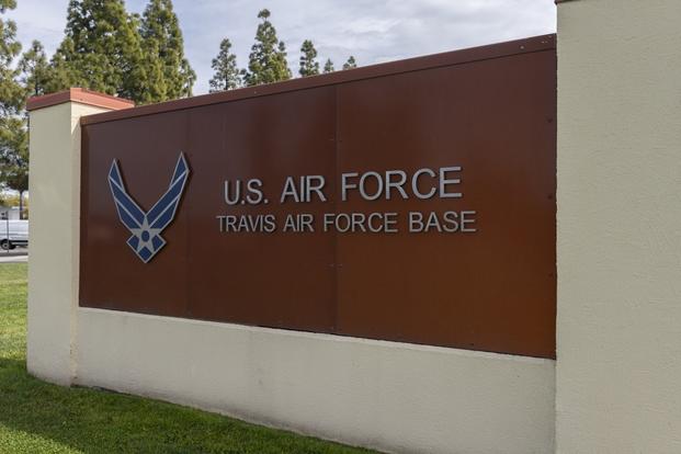 Photo of the base sign in front of the Visitor Control Center at Travis Air Force Base, California.