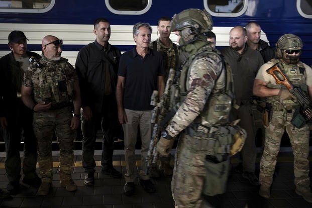 U.S. Secretary of State Antony Blinken stands next to Ukrainian security forces 