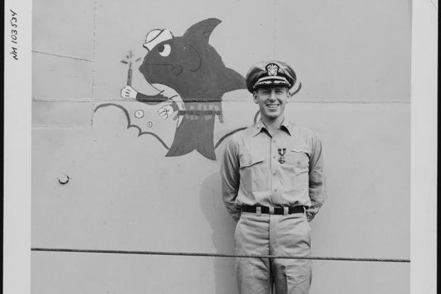 USS Barb commanding officer Eugene Fluckey stands by the submarine after receiving the Navy Cross on Dec. 6, 1944. 