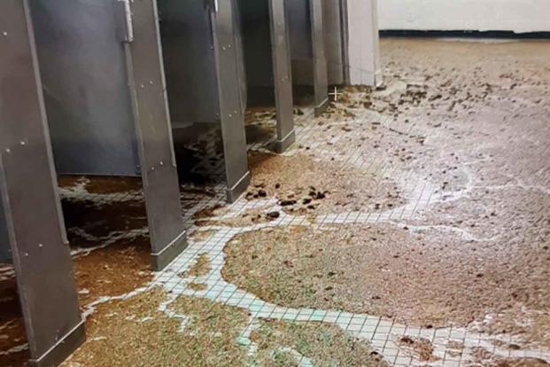 Sewage overflow in a military training barracks restroom