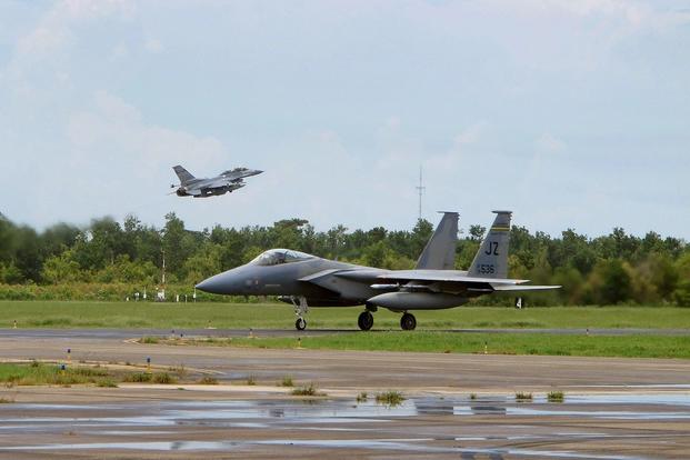 U.S. Air Force airmen with the South Carolina Air National Guard from McEntire Joint National Guard Base, S.C., conduct flight line activities during an F-16 Fighting Falcon training mission at the Naval Air Station Joint Reserve Base New Orleans, La., June 20, 2013.