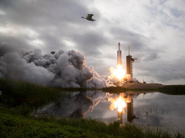 A SpaceX Falcon Heavy rocket with the Psyche spacecraft onboard is launched from Launch Complex 39A