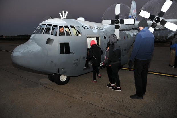 U.S. Air Force members from the 145th Maintenance Squadron, North Carolina Air National Guard, give rides to children and other participants on the ever-so-popular mini C-130 during the seventh annual 5-K Runway Walk/Run at Charlotte-Douglas International Airport.