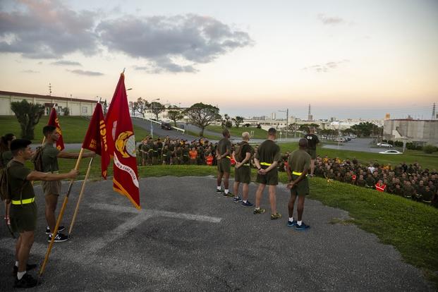 U.S. Marines assigned to Headquarters and Support Battalion, Marine Corps Base Camp Butler, gather for a safety brief after a battalion run at Camp Foster, Okinawa, Japan, Nov. 8, 2018.