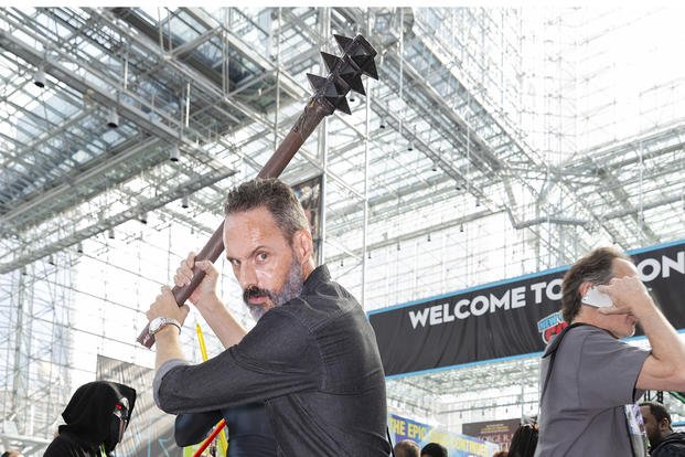 An attendee dressed as Rick Grimes from ‘The Walking Dead’ poses at New York Comic Con in 2018.