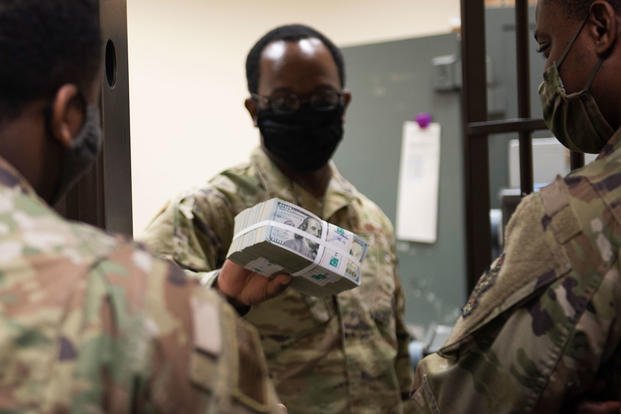 U.S. currency from within the cash cage during an immersion tour at Incirlik Air Base, Turkey