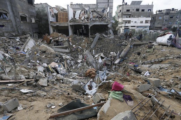 destruction after an Israeli strike at a residential building in Deir al Balah, Gaza Strip