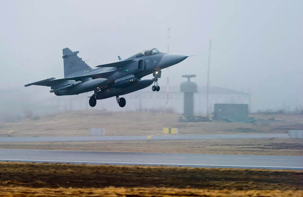 One of three Swedish Air Force JAS 39 Gripen fighter aircraft takes off from the Blekinge Wing F17