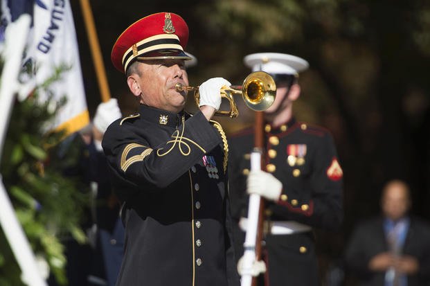 An Army bugler plays ‘taps’ during a 2014 Veterans Day ceremony at Arlington National Cemetery.