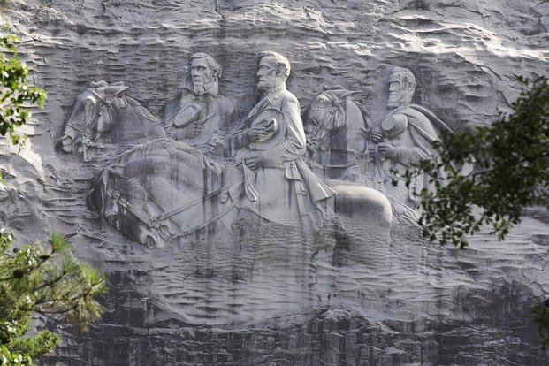 A carving depicting Confederate Civil War figures Stonewall Jackson, Robert E. Lee and Jefferson Davis is shown on Stone Mountain, Ga. 