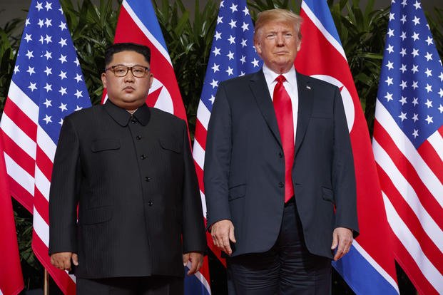 U.S. President Donald Trump, right, meets with North Korean leader Kim Jong Un on Sentosa Island