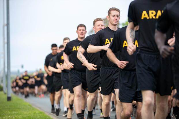 U.S. soldiers, assigned to the 2nd Cavalry Regiment, run toward the finish line during Dragoon Week at Rose Barracks, Vilseck, Germany.