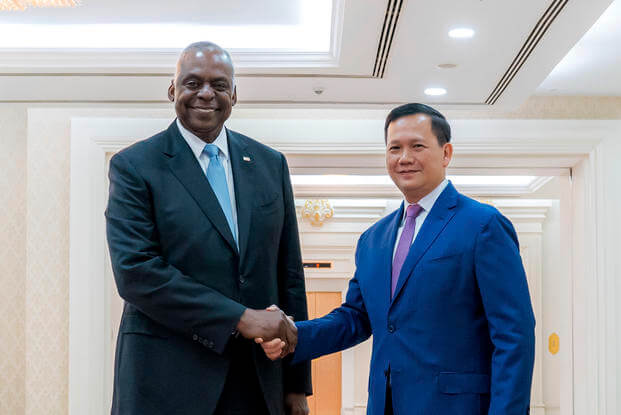 U.S. Defense Secretary Lloyd Austin, left, shakes hands with Cambodian Prime Minister Hun Manet