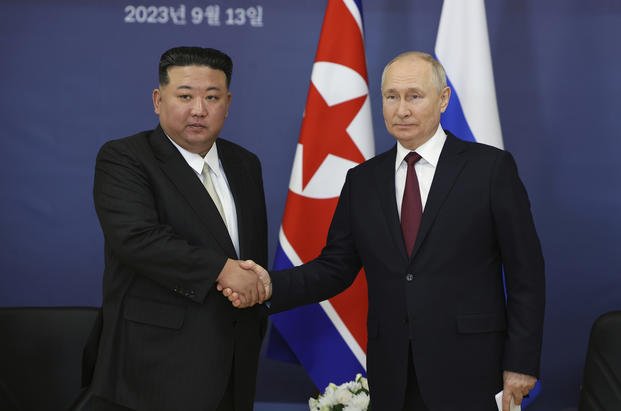 Russian President Vladimir Putin, right, and North Korean leader Kim Jong Un